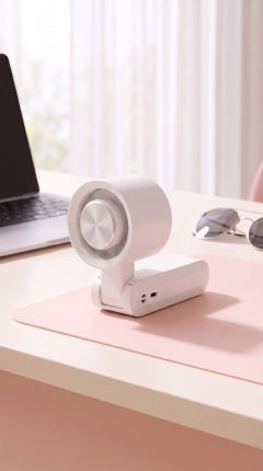 IceBreeze folded on desk with laptop